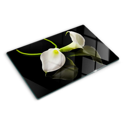 Tagliere in vetro con motivo a giglio su sfondo nero