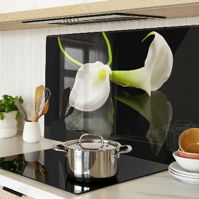 Tagliere in vetro con motivo a giglio su sfondo nero