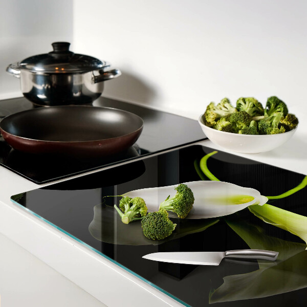 Tagliere in vetro con motivo a giglio su sfondo nero