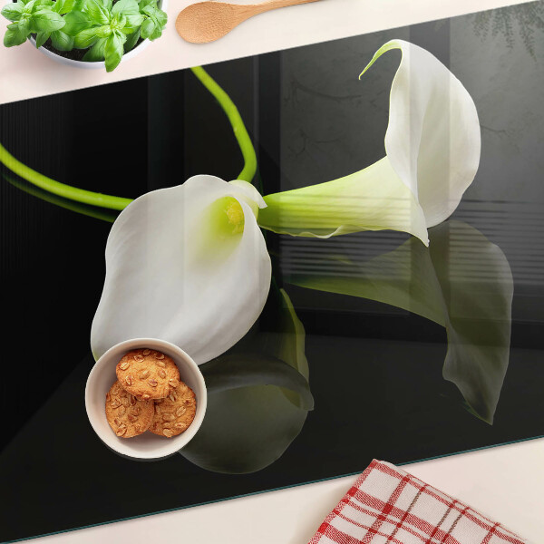 Tagliere in vetro con motivo a giglio su sfondo nero