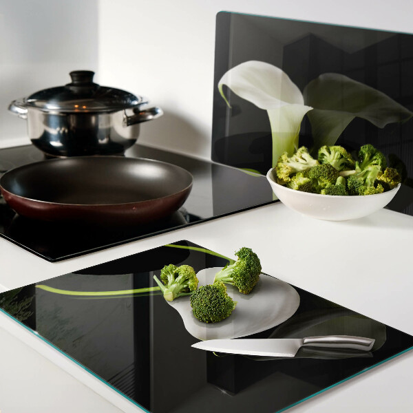 Tagliere in vetro con motivo a giglio su sfondo nero