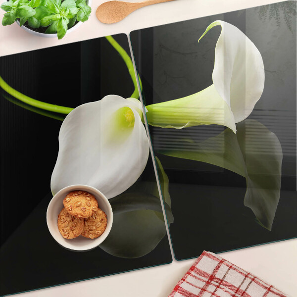 Tagliere in vetro con motivo a giglio su sfondo nero