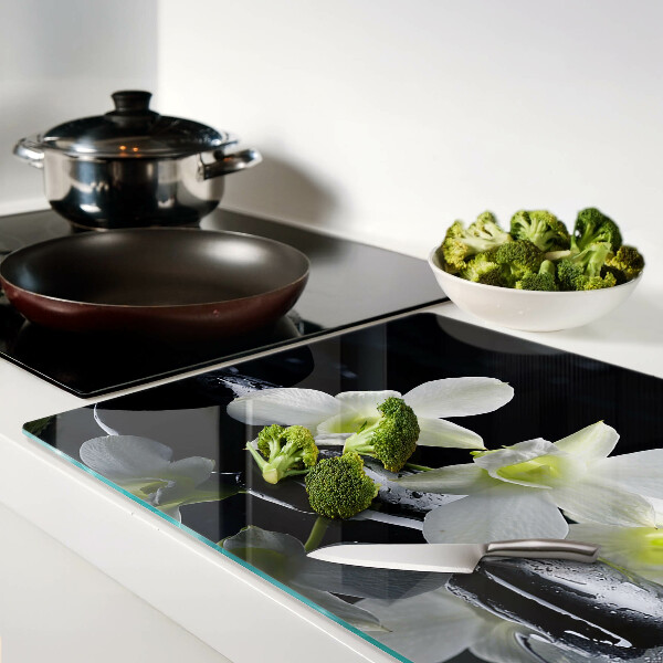 Tagliere in vetro temperato con motivo di orchidee su sfondo nero