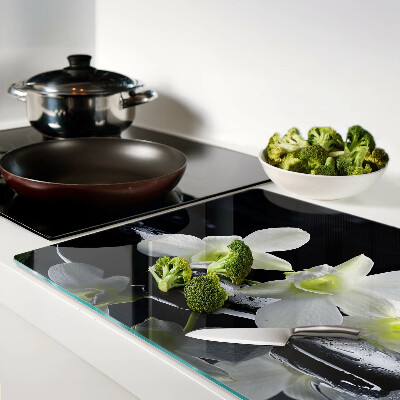 Tagliere in vetro temperato con motivo di orchidee su sfondo nero