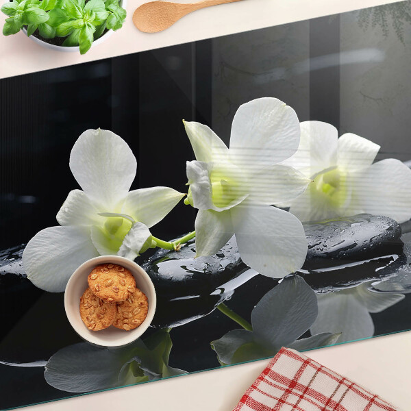 Tagliere in vetro temperato con motivo di orchidee su sfondo nero