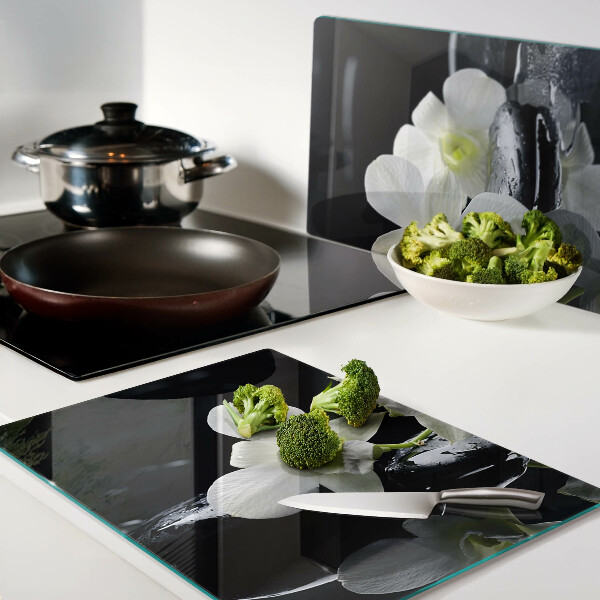 Tagliere in vetro temperato con motivo di orchidee su sfondo nero