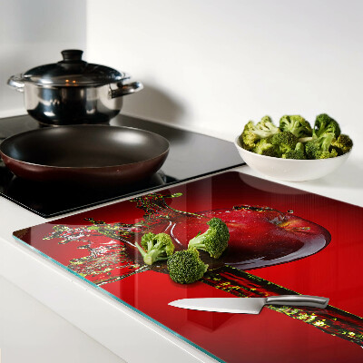 Tagliere in vetro temperato con motivo di mela rossa e gocce d'acqua