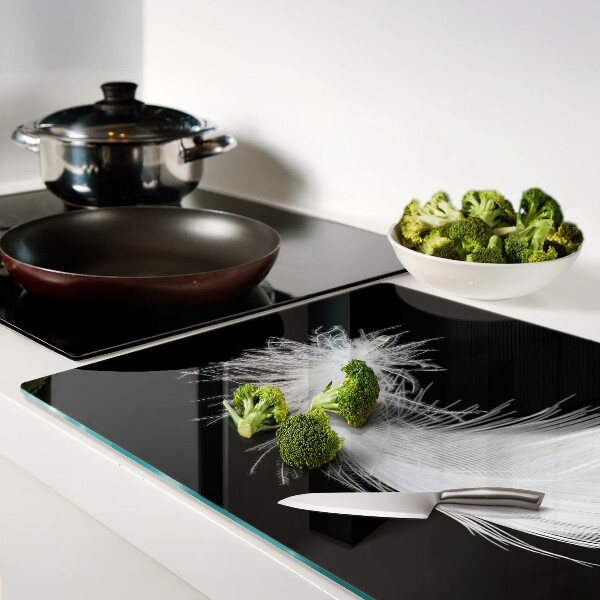 Tagliere in vetro temperato con motivo a piuma su sfondo nero