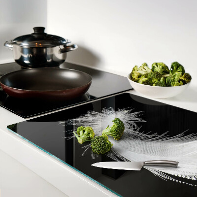 Tagliere in vetro temperato con motivo a piuma su sfondo nero