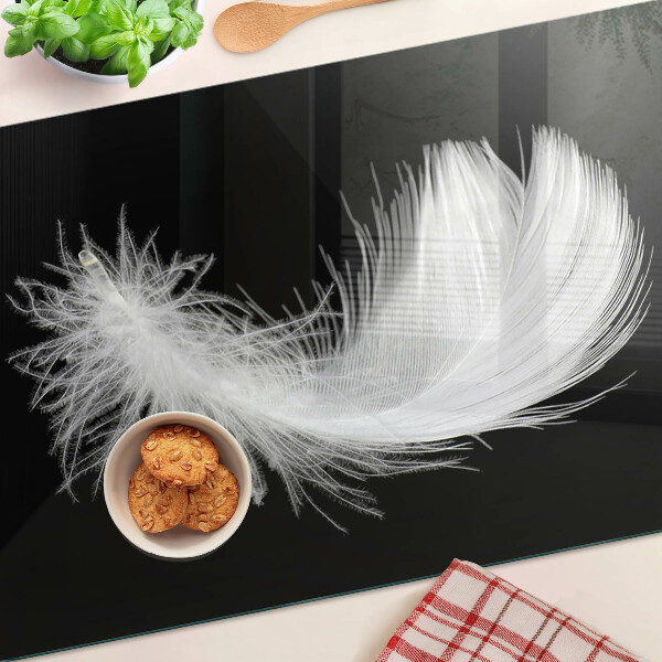 Tagliere in vetro temperato con motivo a piuma su sfondo nero