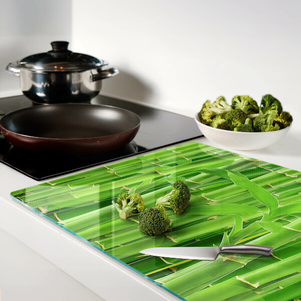 Tagliere in vetro con motivo di foglie e fusti di bamboo