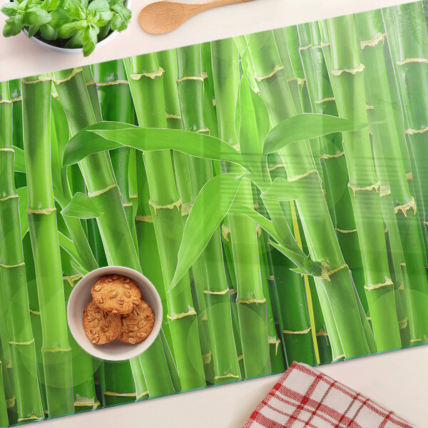 Tagliere in vetro con motivo di foglie e fusti di bamboo