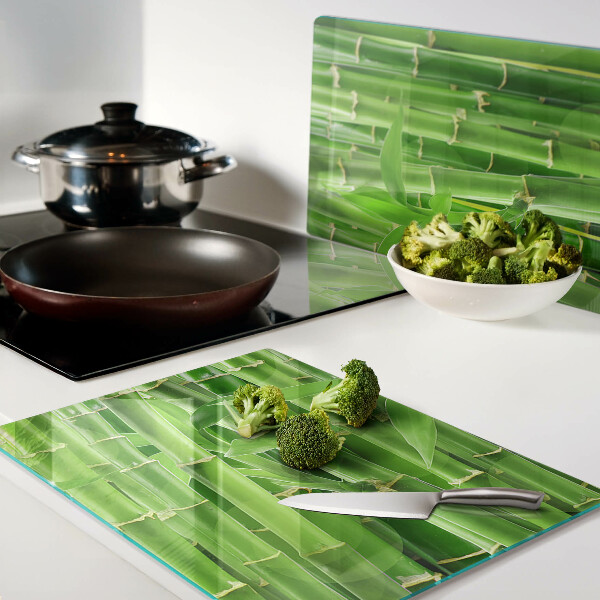 Tagliere in vetro con motivo di foglie e fusti di bamboo