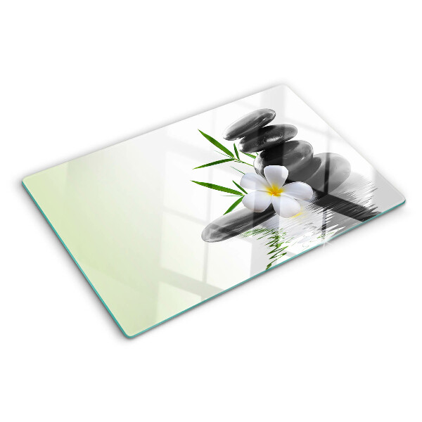 Tagliere in vetro temperato con motivo di fiori e pietre sull'acqua