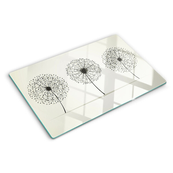 Tagliere in vetro temperato con motivo di denti di leone su sfondo bianco