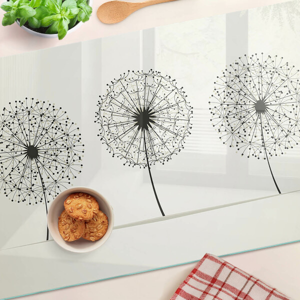 Tagliere in vetro temperato con motivo di denti di leone su sfondo bianco