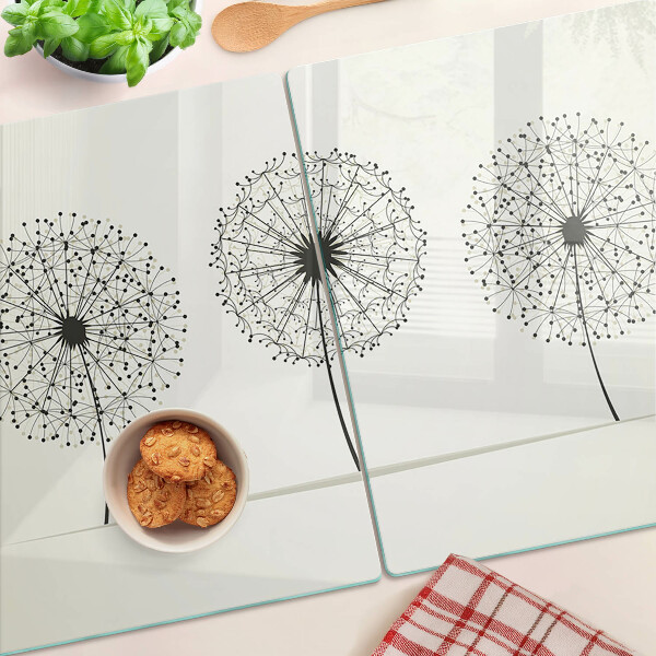 Tagliere in vetro temperato con motivo di denti di leone su sfondo bianco