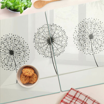 Tagliere in vetro temperato con motivo di denti di leone su sfondo bianco