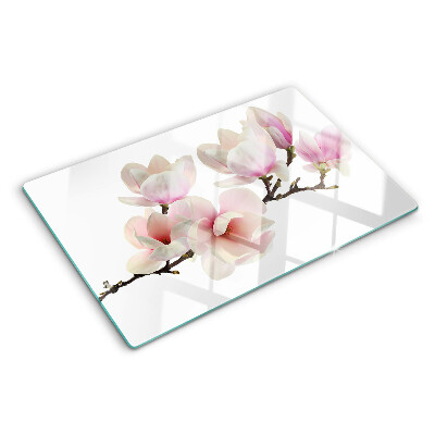 Tagliere in vetro con decorazione con fiori di magnolia su ramo