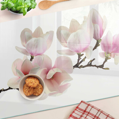 Tagliere in vetro con decorazione con fiori di magnolia su ramo