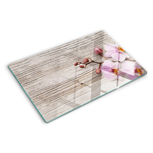 Tagliere in vetro temperato con motivo di orchidee su sfondo di legno