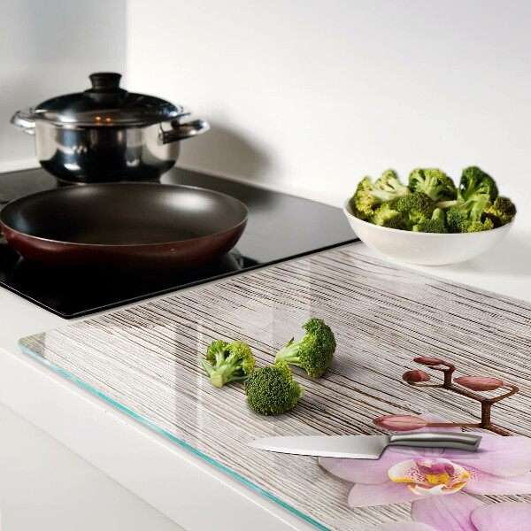 Tagliere in vetro temperato con motivo di orchidee su sfondo di legno