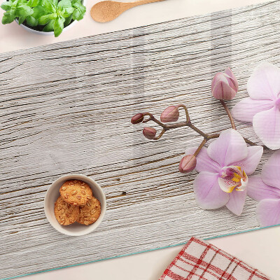 Tagliere in vetro temperato con motivo di orchidee su sfondo di legno