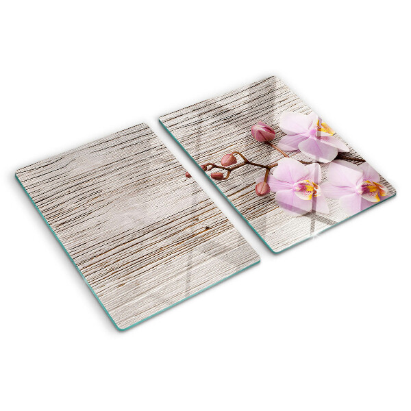 Tagliere in vetro temperato con motivo di orchidee su sfondo di legno