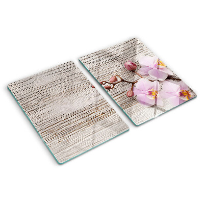 Tagliere in vetro temperato con motivo di orchidee su sfondo di legno