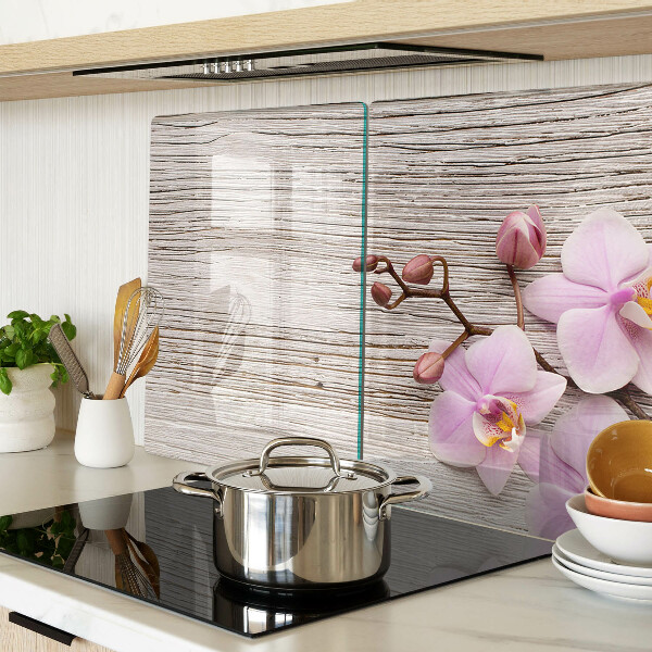 Tagliere in vetro temperato con motivo di orchidee su sfondo di legno