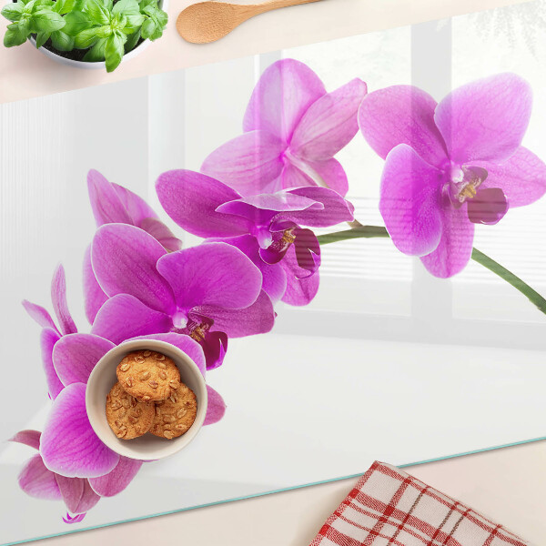 Tagliere in vetro temperato con motivo di fiori di orchidea nei toni del rosa