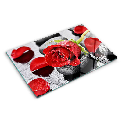 Tagliere in vetro temperato Rosa sulle pietre con gocce d'acqua