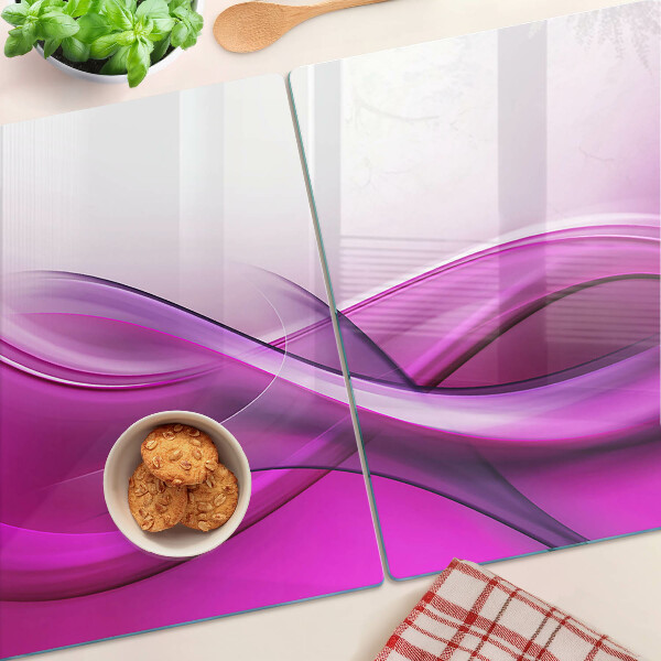 Tagliere in vetro temperato con motivo a onde nei toni del rosa