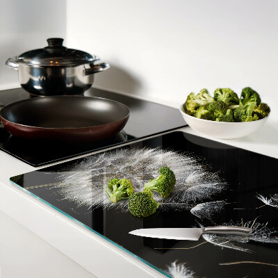 Tagliere in vetro temperato con motivo di denti di leone su sfondo nero