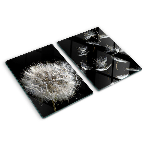 Tagliere in vetro temperato con motivo di denti di leone su sfondo nero