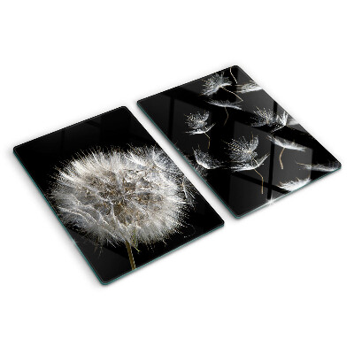 Tagliere in vetro temperato con motivo di denti di leone su sfondo nero