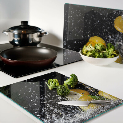 Tagliere in vetro con motivo di limoni in acqua