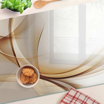 Tagliere in vetro con stampa di onde astratte nei toni del beige