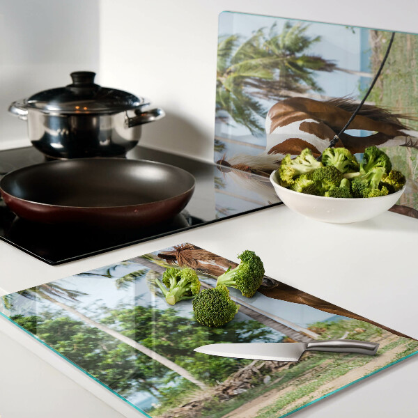 Tagliere in vetro temperato con cavallo su sfondo di palme