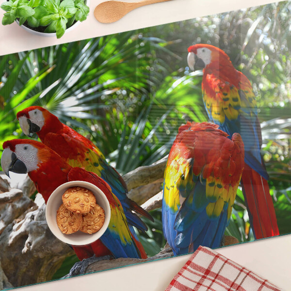 Tagliere in vetro con stampa raffigurante pappagalli in un ambiente tropicale