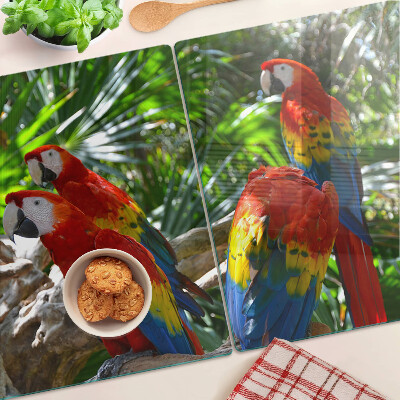 Tagliere in vetro con stampa raffigurante pappagalli in un ambiente tropicale
