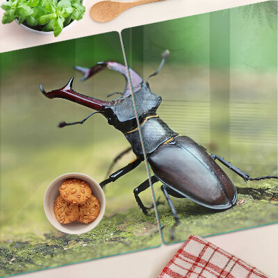 Tagliere in vetro temperato con decorazione raffigurante un cervo maschio su sfondo verde