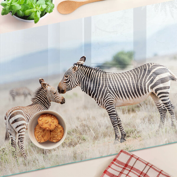 Tagliere in vetro temperato con motivo zebre sul prato