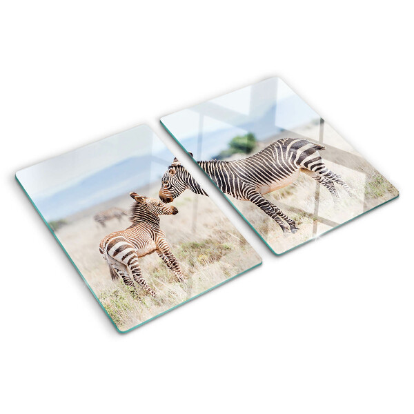 Tagliere in vetro temperato con motivo zebre sul prato