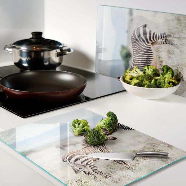 Tagliere in vetro temperato con motivo zebre sul prato