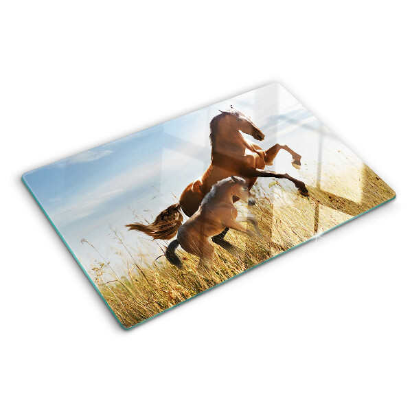 Tagliere in vetro con stampa di cavalli che pascolano al sole