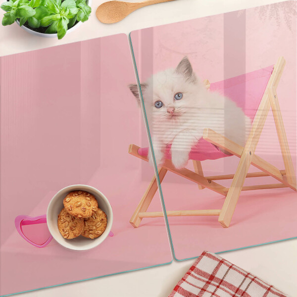 Tagliere in vetro temperato con stampa di un gattino sulla sdraio su sfondo rosa