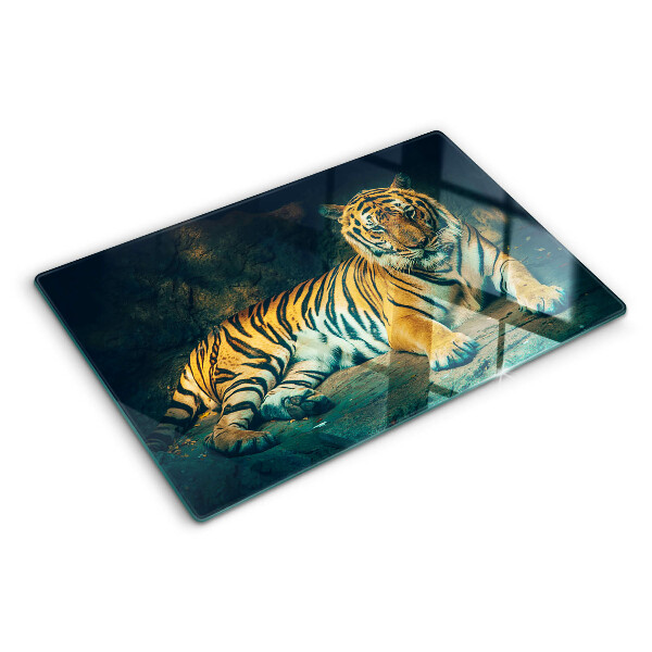 Tagliere in vetro con stampa di una tigre sdraiata sulle rocce
