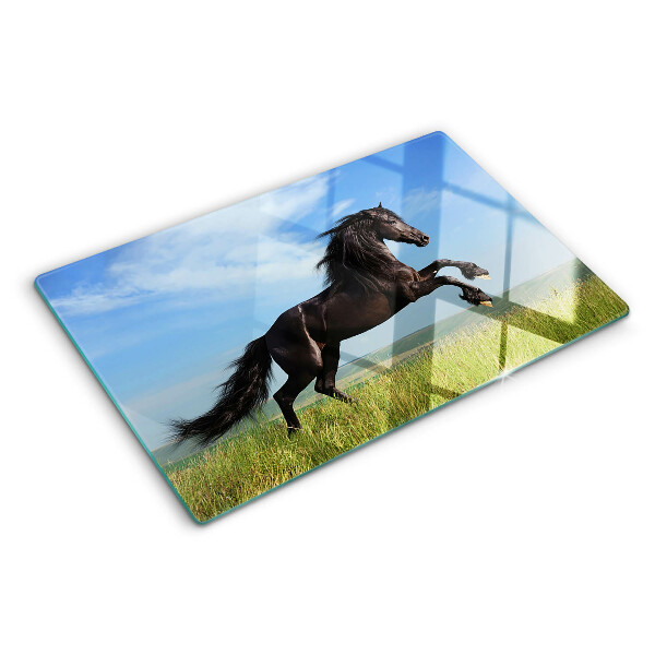 Tagliere in vetro con decorazione di un cavallo nero sul prato