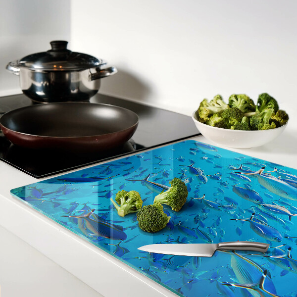 Tagliere in vetro temperato con decorazione raffigurante un banco di pesci sull'acqua